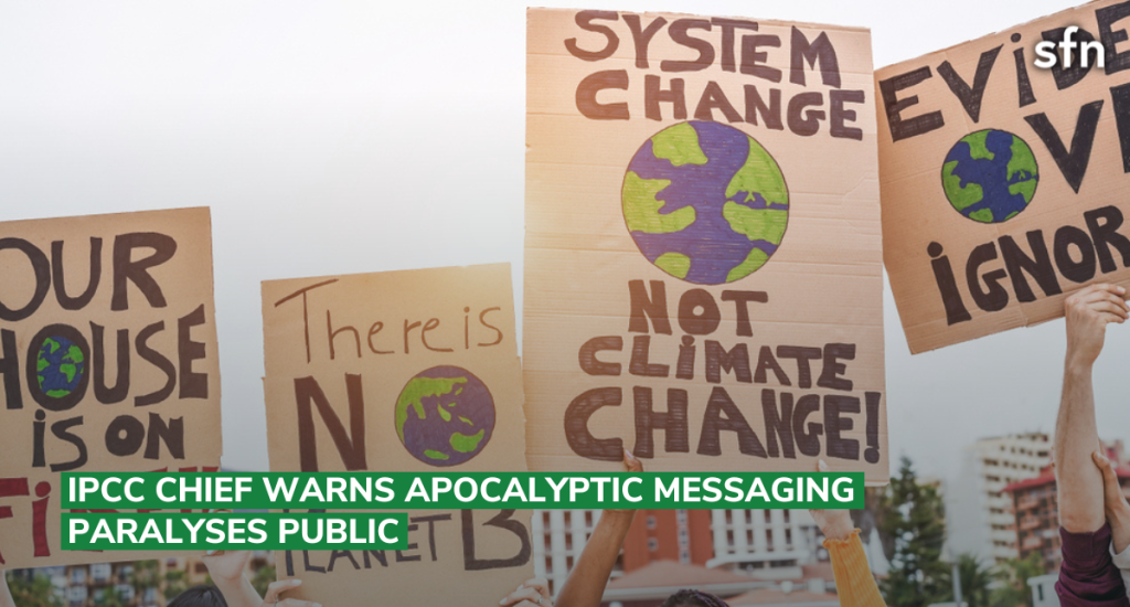 Climate protestors holding up signs
